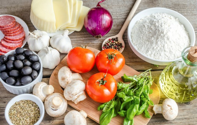 Ingredients for pizza on the wooden background